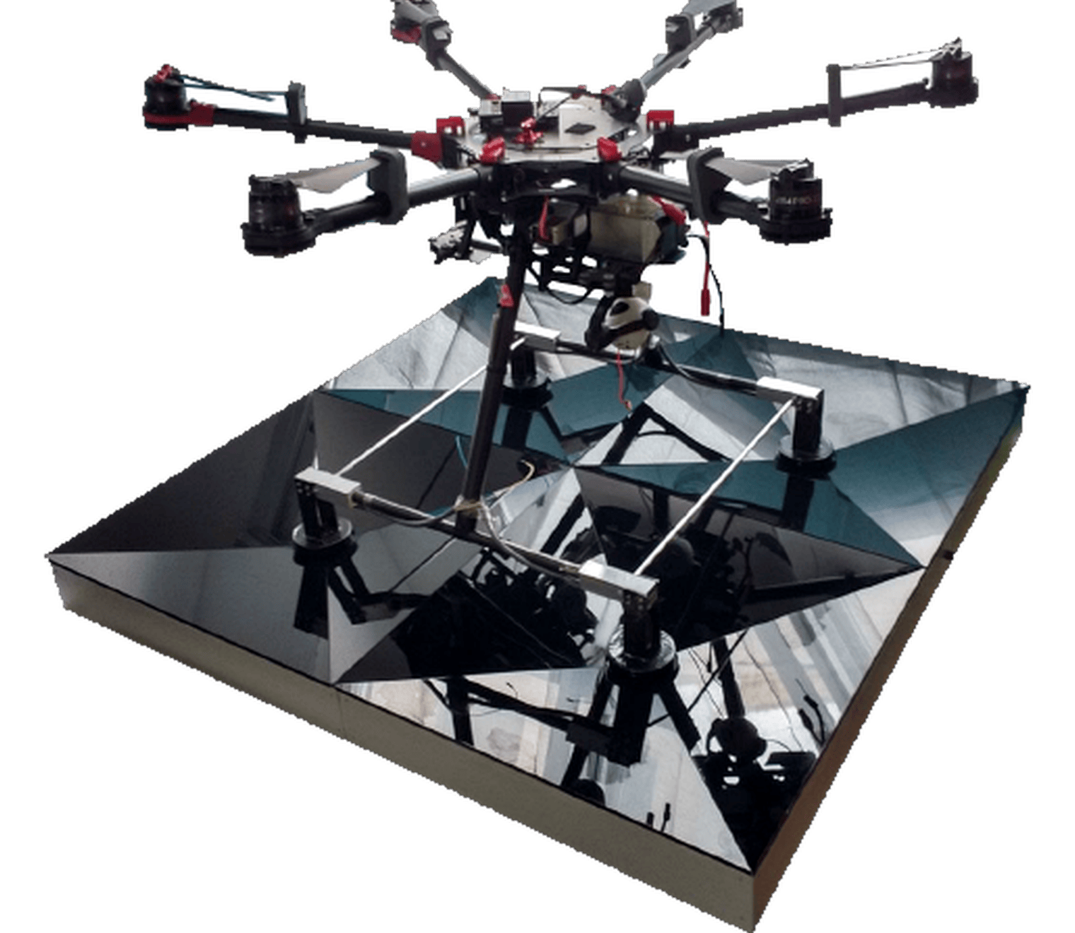 Divisek wireless charging station with an industrial drone positioned above the landing platform